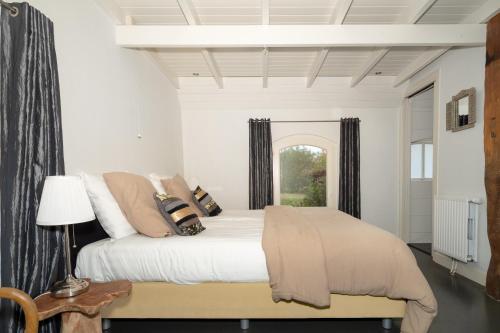 Postel nebo postele na pokoji v ubytování Bonkert Buiten