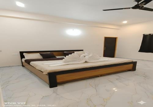 a bedroom with a large bed in a room at Hotel Pampa Sarovar in Chhatarpur