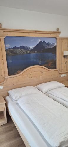 En eller flere senge i et værelse på Albergo Garni Martina