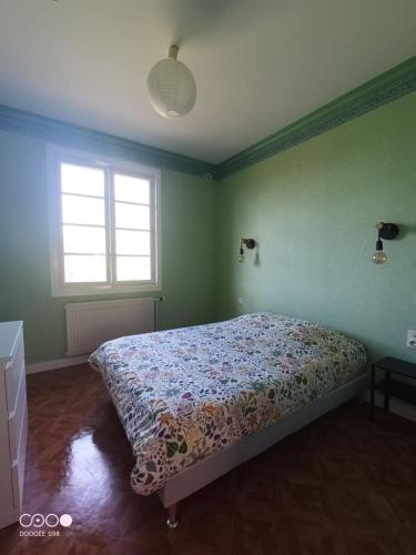 Postel nebo postele na pokoji v ubytování appartement avec terrasse et jardin