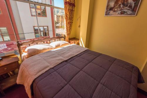 Postel nebo postele na pokoji v ubytování Hotel Galaxia