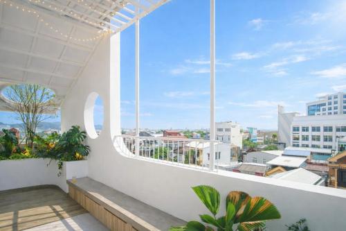 a balcony with a view of a city at Adory Homestay Huế in Hue