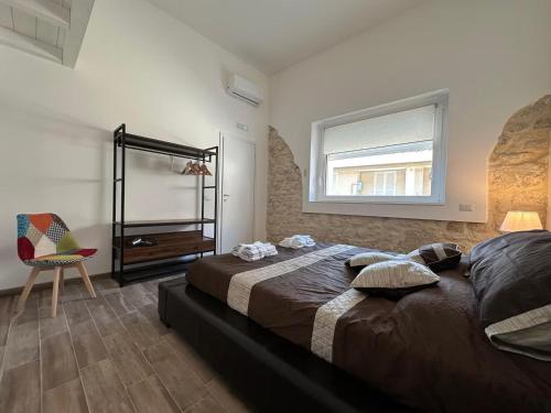 En eller flere senge i et værelse på Pietre al Sole di Sicilia