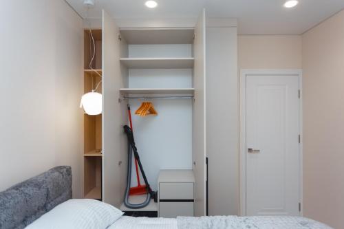 Llit o llits en una habitació de HomeRent Dimo