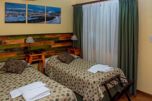 Ένα ή περισσότερα κρεβάτια σε δωμάτιο στο Hosteria Les Eclaireurs
