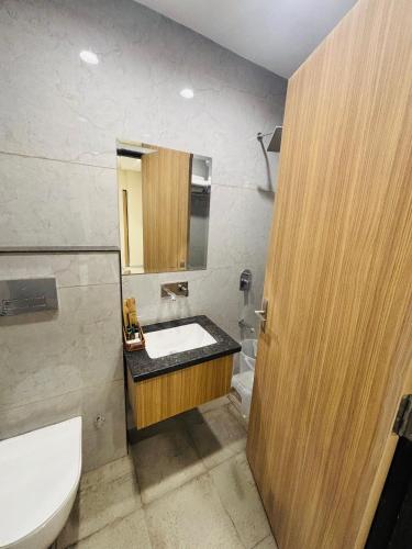 a bathroom with a sink and a toilet at MG Plaza Hotel in Jodhpur