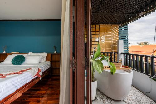 Ένα ή περισσότερα κρεβάτια σε δωμάτιο στο BlueHome Apartment