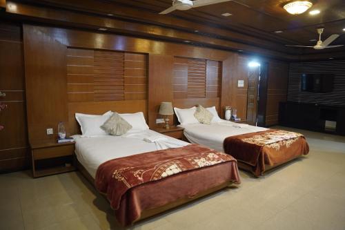 Postel nebo postele na pokoji v ubytování Ali International Hotel