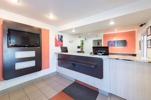 a kitchen with a refrigerator, microwave, sink, and dishwasher at Motel 6-Carson City, NV in Carson City