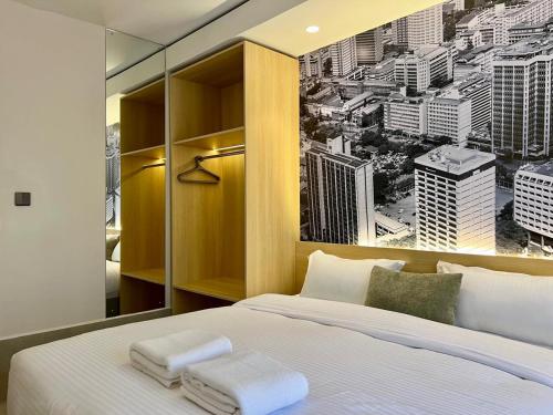 a bedroom with a large window with a city view at Kozi - Wilson Airport in Nairobi