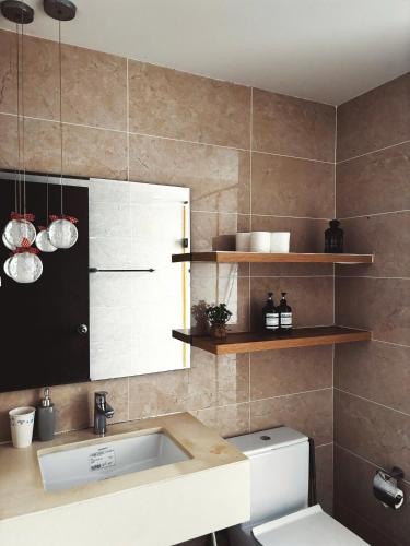 a bathroom with a sink and a toilet at The Lume Studio - Tresor D4 in Ho Chi Minh City