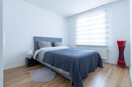 En eller flere senge i et værelse på Apartment-Gravensteen