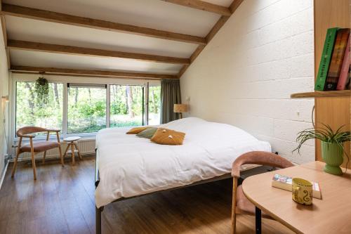 En eller flere senge i et værelse på De Folks