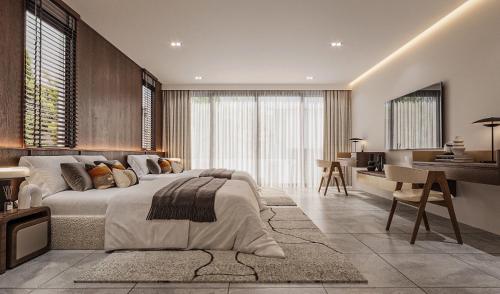 Rivendale في Ban Gaeng Cho: غرفة نوم بها سرير كبير وغرفة معيشة