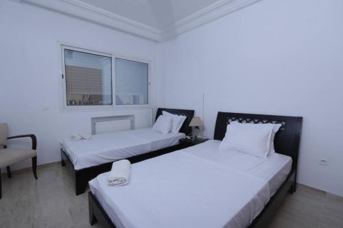 Giường trong phòng chung tại The Carthage Garden Nest, cozy S 20