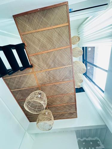 a room with a large window and some ropes at Saffron Villa in Pampang