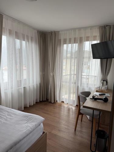 Giường trong phòng chung tại SPA Hotel Daffi