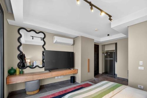 Et tv og/eller underholdning på Sodic Villette New Cairo Serviced Apartments by BirdNest