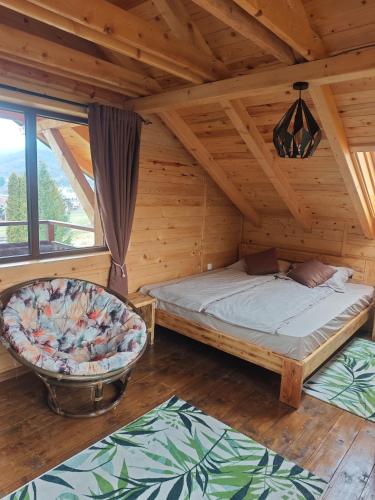 En eller flere senge i et værelse på Wooden crown