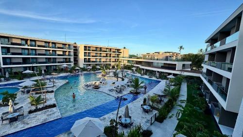 een bovenaanzicht van een zwembad in een resort bij Malia Beach Experience - Muro Alto/PE in Cupe