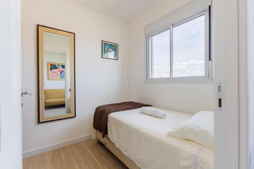 En eller flere senge i et værelse på Apartamento com espaço de trabalho completo - Estação João Dias CPTM