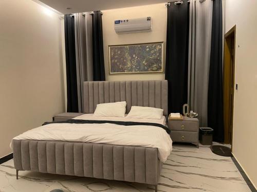 En eller flere senge i et værelse på ASNB Residences 2BHK -F4