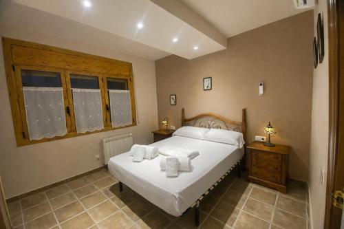 En eller flere senge i et værelse på Winahost les Faldas del Montseny