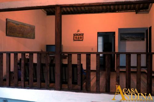 a balcony of a house with a wooden railing at Hostal Casa Lantana in Suesca