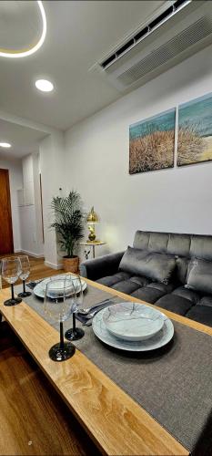 a living room with a couch and a table at Cabedelo Studio Residence in Viana do Castelo