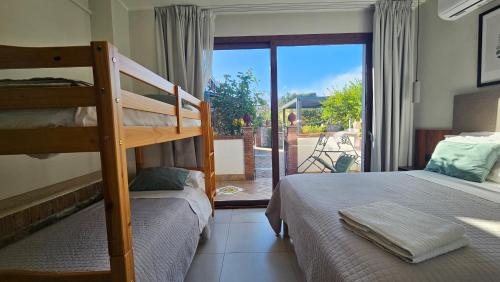 En eller flere senge i et værelse på Villa Antonino