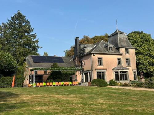 a large house with a large yard in front of it at Luxury Estate with Pool & Spa in Jamoigne