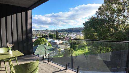 a balcony with a view of a city at Howick Heights Unit 3, Inner Launceston Living in Launceston