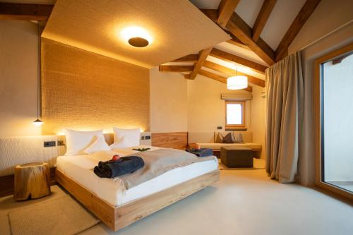 a bedroom with a large bed in a room at Hotel Schönblick in Rodengo