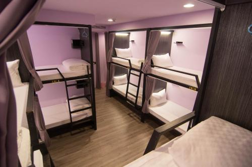 an overhead view of a room with several bunk beds at Backpackers Hostel - Taipei Changchun in Taipei