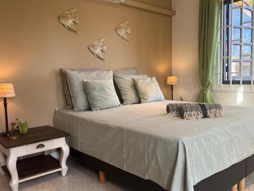 Postel nebo postele na pokoji v ubytování Kas Emmali Curacao