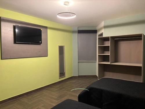 Et tv og/eller underholdning på Hotel Azomali plus