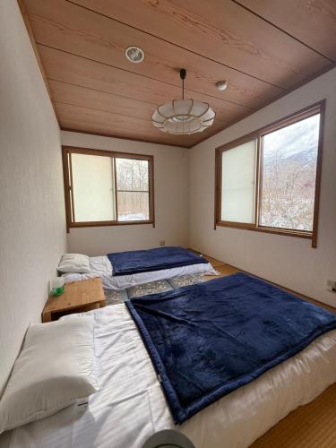 En eller flere senge i et værelse på 雪之宿