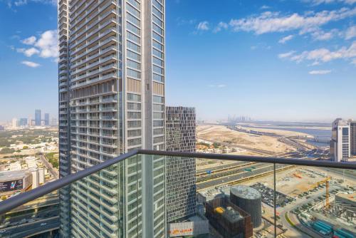 a view of a tall building in a city at The Address Fountain Views - Residence 2 Bedroom with Burj Khalifa view and access to Dubai mall in Dubai