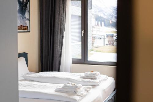 Postel nebo postele na pokoji v ubytování Bergblick Apartment I Andermatt I Mountain I Familien