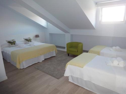 Postel nebo postele na pokoji v ubytování QUO Almeida Garrett