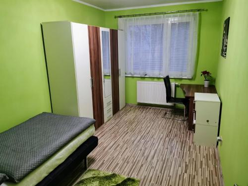 En eller flere senge i et værelse på Wolkrova city stay