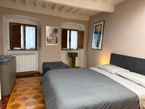 En eller flere senge i et værelse på Maison Vasari - Centro Storico di Arezzo