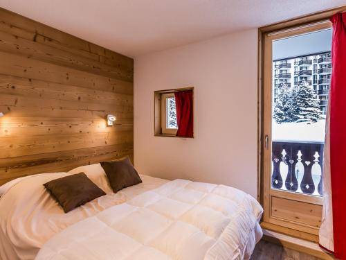 En eller flere senge i et værelse på Appartement rénové au coeur de Val-d'Isère - FR-1-518-25