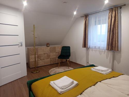 En eller flere senge i et værelse på President Apartmanház