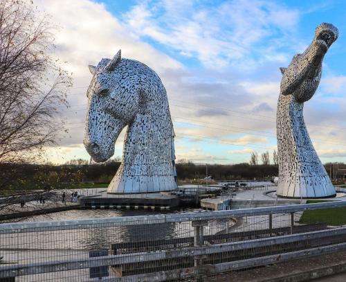two large statues of a horse and a pigeon at Beechtree Timber Lodge 69B in Denny