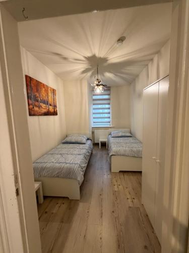 En eller flere senge i et værelse på Offenbach Work & Sleep