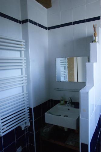 a bathroom with a sink and a mirror at House on the hill, near Aubeterre-sur-dronne in Saint-Romain