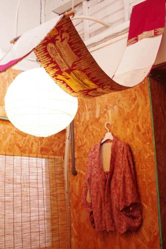 a bathroom with a towel hanging from a ceiling at Kichinan in Osaka