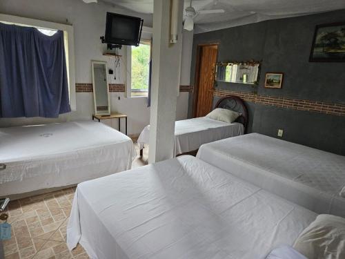 Postel nebo postele na pokoji v ubytování Pousada SRP - Recanto do Paraiso