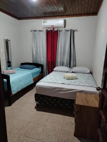 Postel nebo postele na pokoji v ubytování Hospedaje carvajal